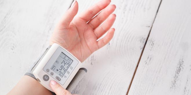 Woman is taking care for health with hearth beat monitor and blood pressure.