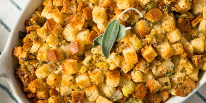 a baking dish full of gluten-free stuffing with nuts and fruit