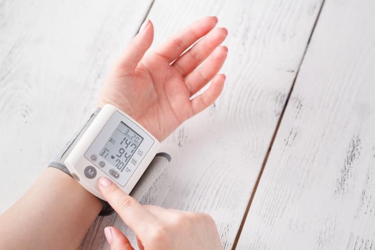 Woman is taking care for health with hearth beat monitor and blood pressure.